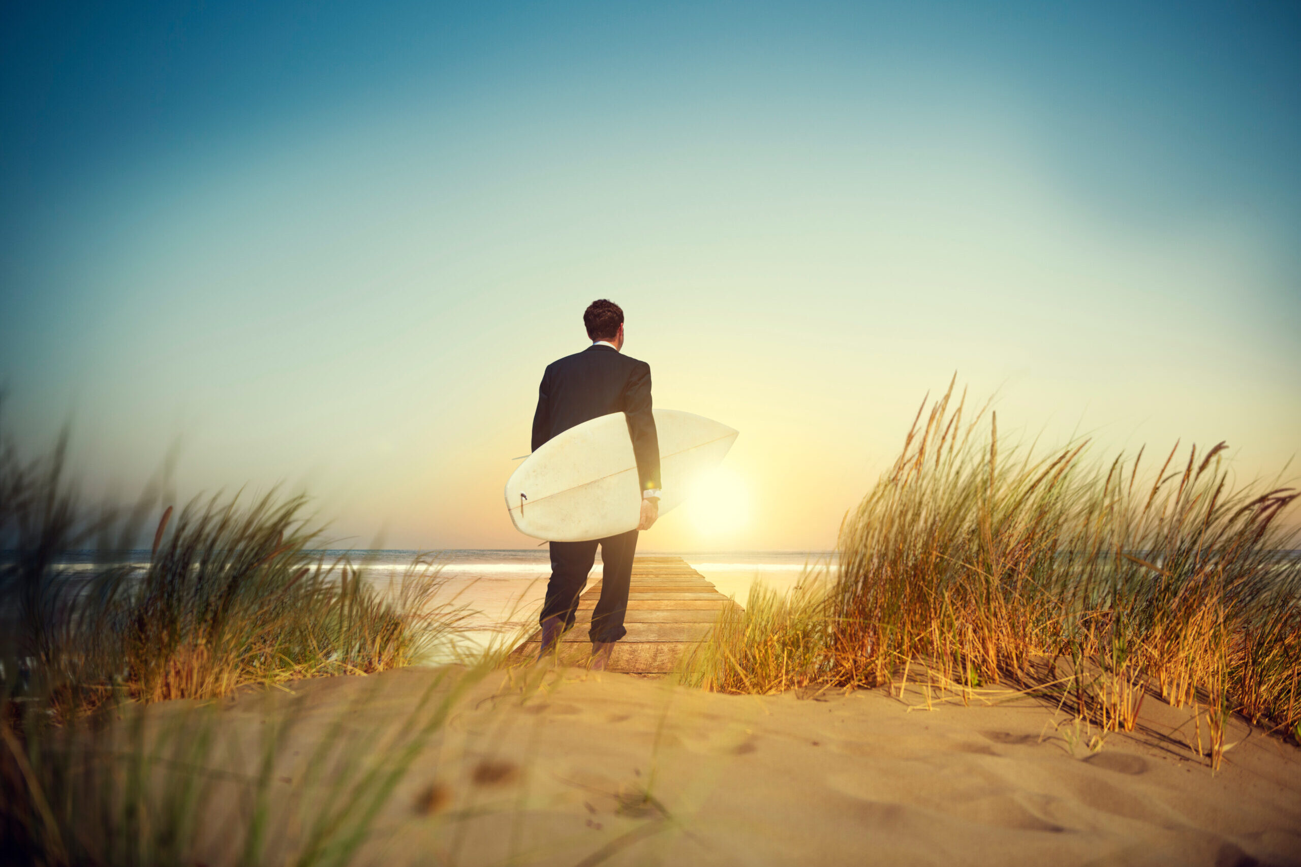 Lone Businessman by the Beach with Surfboard Concept